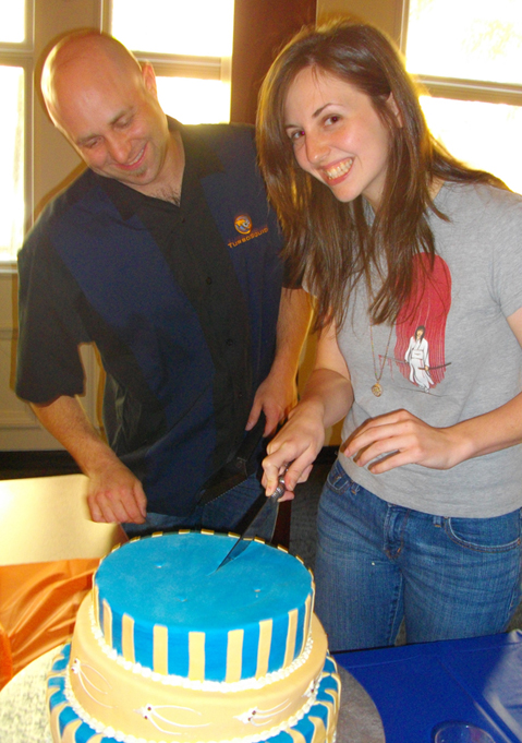 Eric Arvidson and Elise Hatheway cut the cake