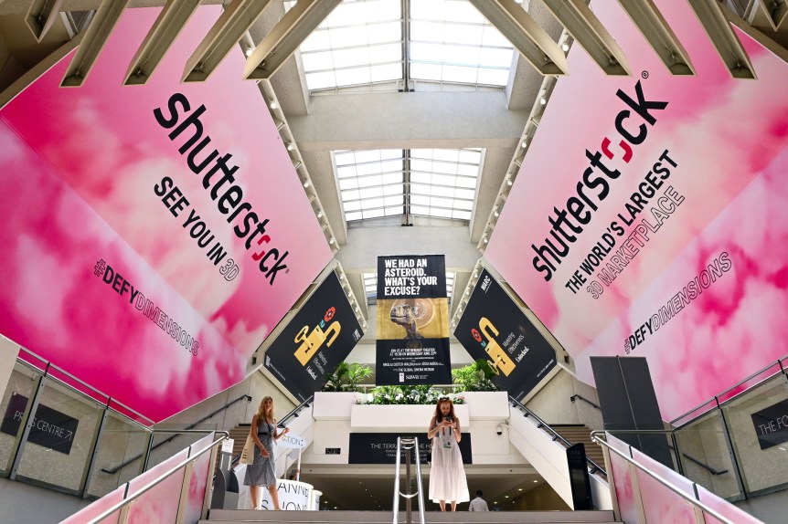 Interior of a building with Shutterstock banners on the wall promoting the 3D installation at Cannes Lions Festival