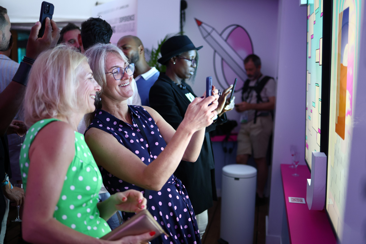 Guests mingling at Shutterstock interactive installation at Cannes Lions 2022.
