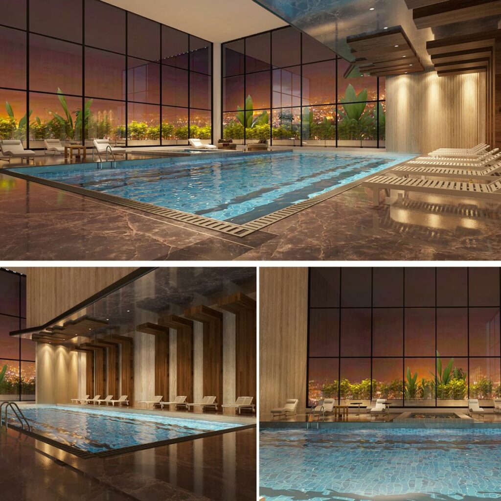 An indoor pool in a luxurious atmosphere with large glass windows surrounding it.